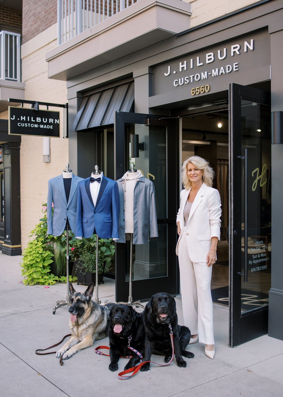 Libby Tonucci with Yukon, Boomer and Zulu outside the J.Hilburn Bridge Park storefront