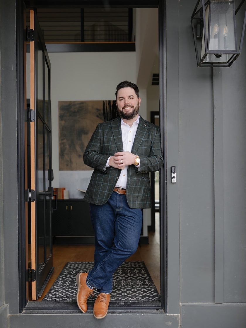 Client in a green windowpane sport coat and denim