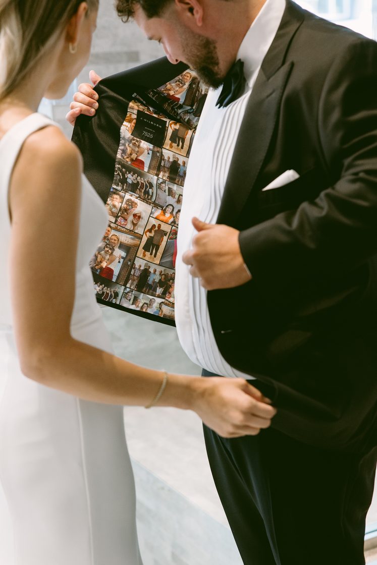 Groom revealing a custom photo-collage jacket lining